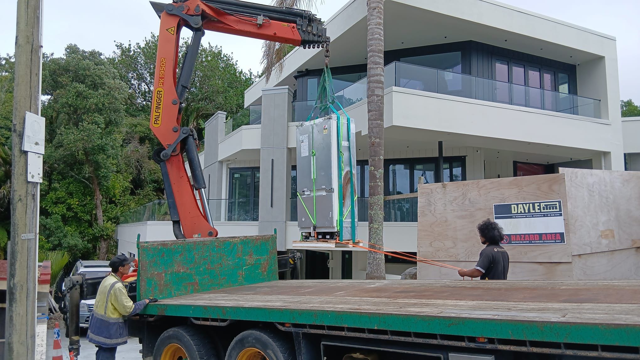 Specialist Movers crane truck preparing a heavy item lift