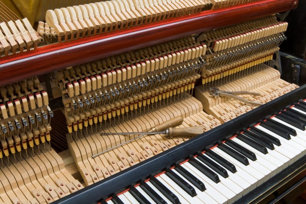 A piano being tuned after a move